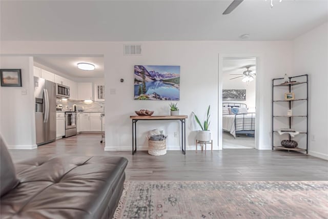 3604 Clawson Rd Unit 204, Austin, TX 78704 - living area featuring ceiling fan and light wood-type flooring