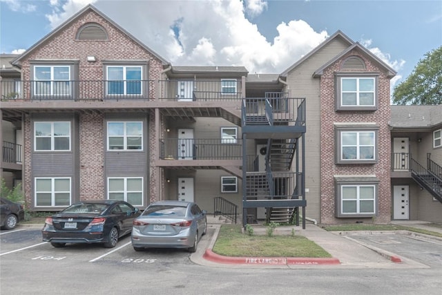 3604 Clawson Rd Unit 204, Austin, TX 78704 - view of property with uncovered parking and stairway