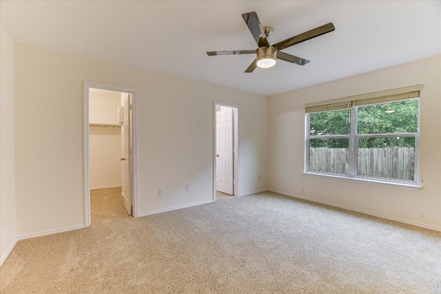 210 Deercreek Ln, Leander, TX 78641 - unfurnished bedroom with carpet floors, a spacious closet, ceiling fan, and a closet