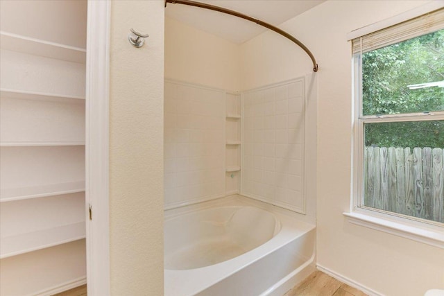210 Deercreek Ln, Leander, TX 78641 - full bath with bathing tub / shower combination and wood finished floors