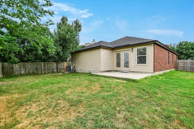 210 Deercreek Ln, Leander, TX 78641 - rear view of house featuring a patio, a fenced backyard, and brick siding
