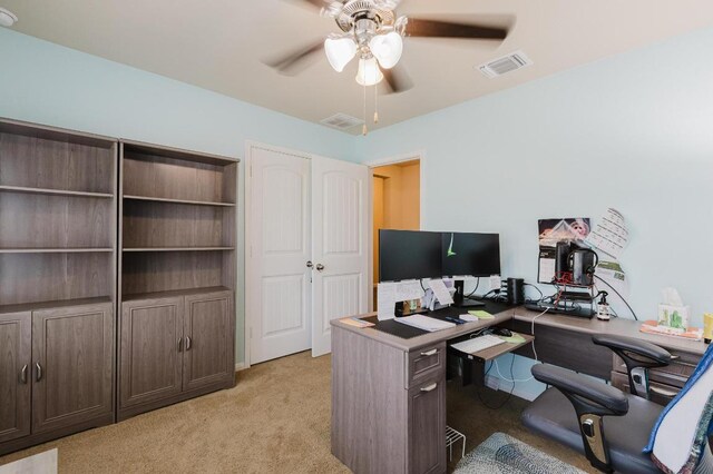 115 San Bernard Trl, Hutto, TX 78634 - home office featuring a ceiling fan and light carpet