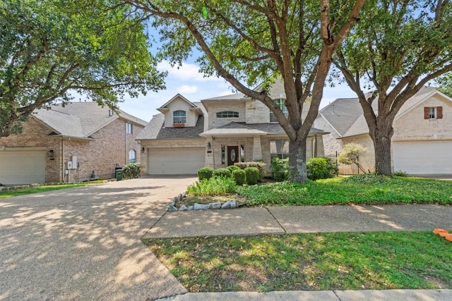 5724 Brittlyns Ct, Austin, TX 78730 - view of front of property with concrete driveway, a garage, brick siding, and a shingled roof