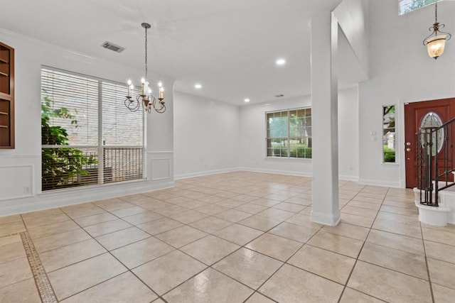 5724 Brittlyns Ct, Austin, TX 78730 - foyer entrance featuring light tile patterned floors, a chandelier, and recessed lighting