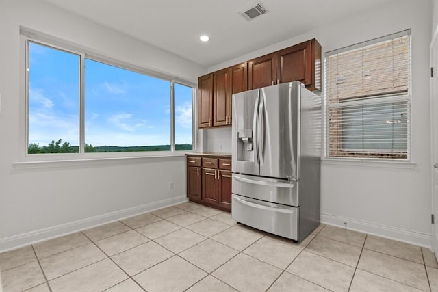 5724 Brittlyns Ct, Austin, TX 78730 - kitchen with stainless steel refrigerator with ice dispenser, light tile patterned flooring, and recessed lighting