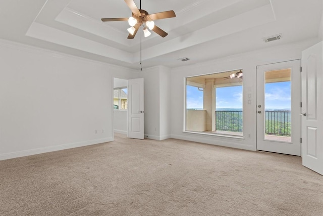 5724 Brittlyns Ct, Austin, TX 78730 - empty room with a tray ceiling, a ceiling fan, and light carpet