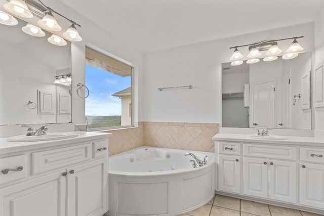 5724 Brittlyns Ct, Austin, TX 78730 - bathroom with two vanities, tile patterned floors, and a jetted tub