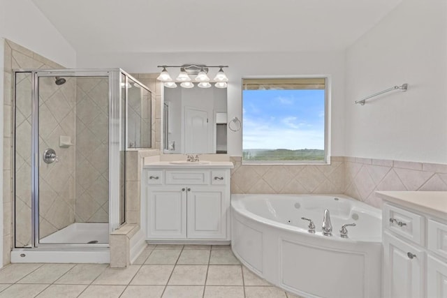 5724 Brittlyns Ct, Austin, TX 78730 - bathroom featuring vanity, a whirlpool tub, tile patterned floors, and a stall shower