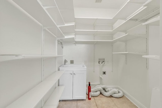 5724 Brittlyns Ct, Austin, TX 78730 - washroom featuring electric dryer hookup, washer hookup, and light tile patterned floors