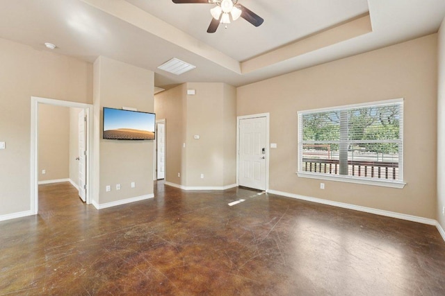 14613 Branding Iron Pass, Austin, TX 78734 - unfurnished living room with concrete floors, ceiling fan, and a raised ceiling
