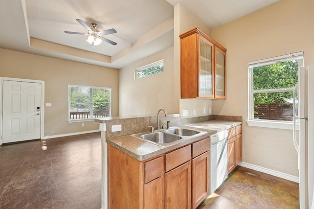 14613 Branding Iron Pass, Austin, TX 78734 - kitchen with white appliances, a ceiling fan, a peninsula, glass insert cabinets, and a raised ceiling