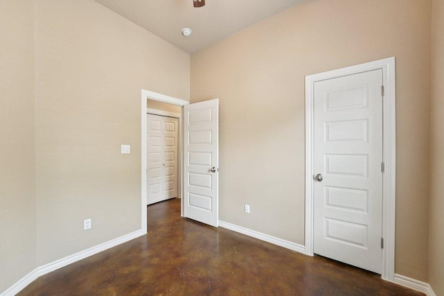 14613 Branding Iron Pass, Austin, TX 78734 - unfurnished bedroom featuring concrete flooring and a towering ceiling