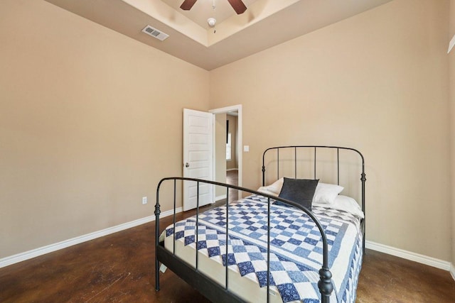 14613 Branding Iron Pass, Austin, TX 78734 - bedroom featuring concrete flooring, a ceiling fan, and a raised ceiling
