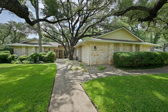 11001 Spicewood Club Dr, Austin, TX 78750 - view of front of property with stone siding and a front yard