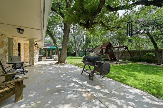 11001 Spicewood Club Dr, Austin, TX 78750 - fenced backyard with a patio, a playground, and a grill