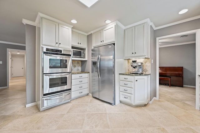 11001 Spicewood Club Dr, Austin, TX 78750 - kitchen featuring stainless steel appliances, a warming drawer, ornamental molding, backsplash, and dark stone countertops
