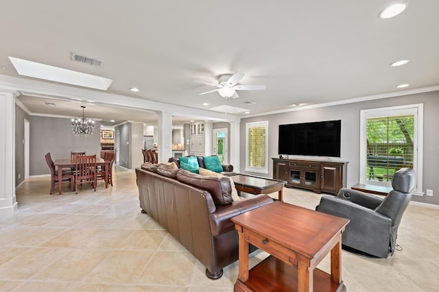 11001 Spicewood Club Dr, Austin, TX 78750 - living area featuring a chandelier, ornamental molding, recessed lighting, a ceiling fan, and a skylight