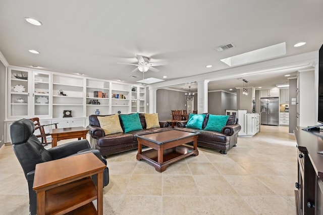11001 Spicewood Club Dr, Austin, TX 78750 - living room featuring ceiling fan, a skylight, recessed lighting, and a chandelier