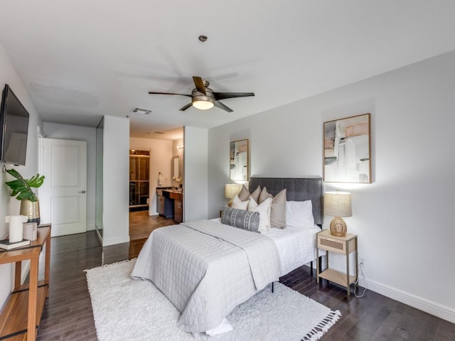 40 N Interstate 35 Unit 2D1, Austin, TX 78701 - bedroom featuring wood finished floors, connected bathroom, and ceiling fan