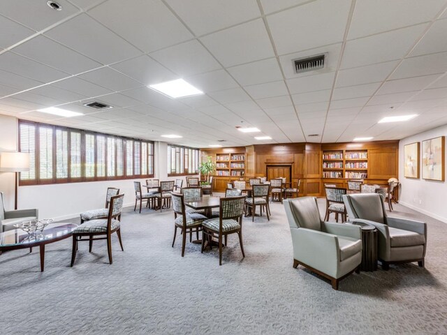40 N Interstate 35 Unit 2D1, Austin, TX 78701 - dining room with carpet flooring, plenty of natural light, and a drop ceiling
