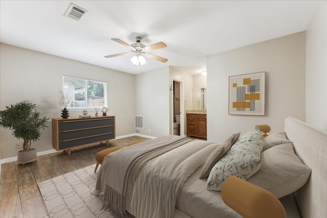 508 Buffalo Pass, Round Rock, TX 78681 - bedroom with light wood-type flooring, ensuite bathroom, and ceiling fan