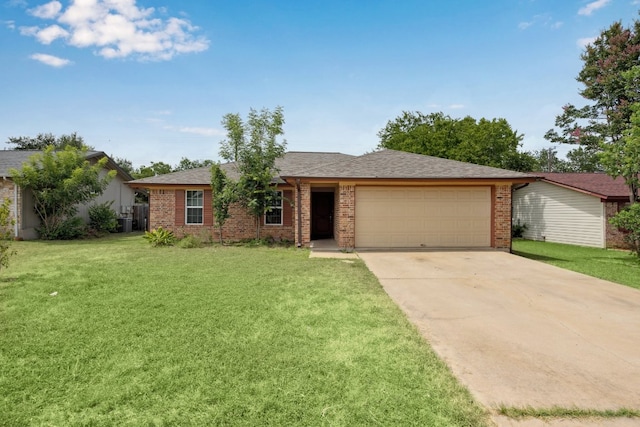 508 Buffalo Pass, Round Rock, TX 78681 - ranch-style home featuring an attached garage, concrete driveway, brick siding, a front lawn, and roof with shingles