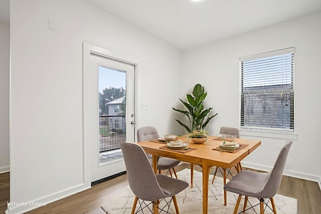 1201 Grove Blvd Unit 1502, Austin, TX 78741 - dining room with plenty of natural light and wood finished floors