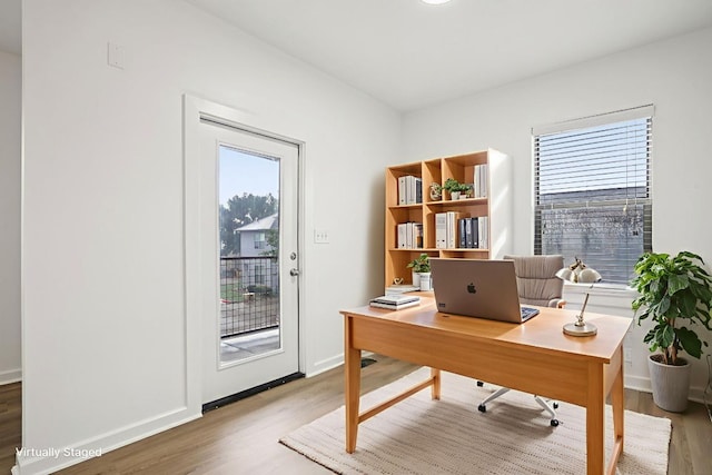 1201 Grove Blvd Unit 1502, Austin, TX 78741 - office area with wood finished floors and baseboards