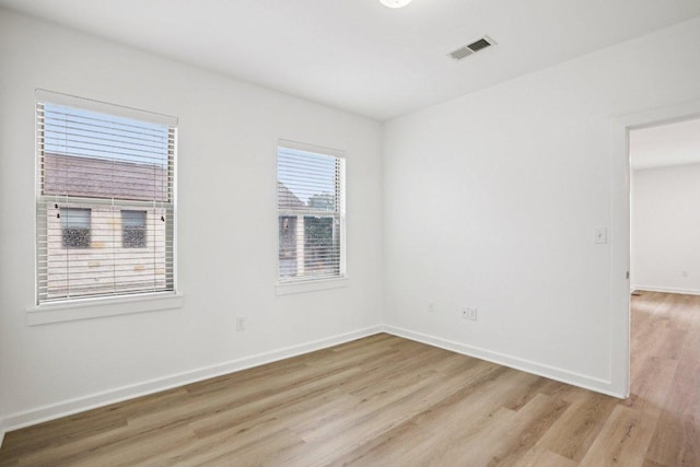 1201 Grove Blvd Unit 1502, Austin, TX 78741 - empty room with light wood-style floors and baseboards