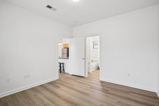 1201 Grove Blvd Unit 1502, Austin, TX 78741 - empty room with wood finished floors and baseboards