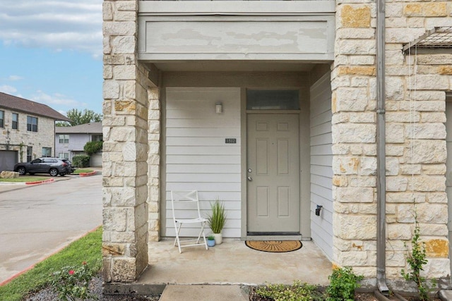 1201 Grove Blvd Unit 1502, Austin, TX 78741 - view of exterior entry featuring stone siding