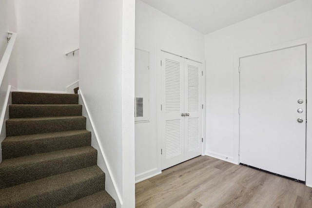 1201 Grove Blvd Unit 1502, Austin, TX 78741 - stairway featuring wood finished floors
