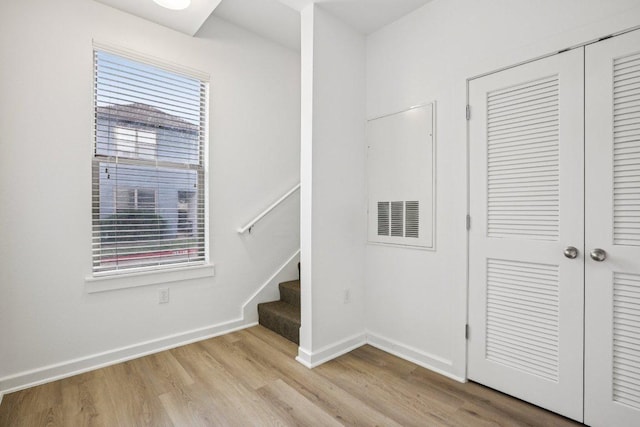 1201 Grove Blvd Unit 1502, Austin, TX 78741 - stairway featuring wood finished floors and baseboards