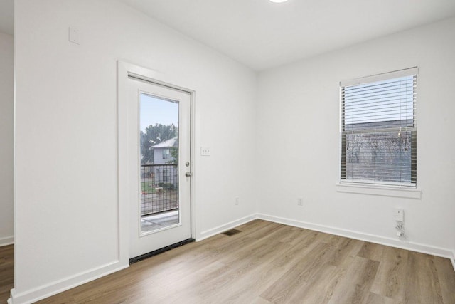 1201 Grove Blvd Unit 1502, Austin, TX 78741 - spare room featuring light wood-type flooring and baseboards