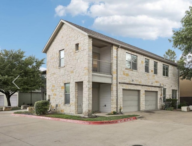 1201 Grove Blvd Unit 1502, Austin, TX 78741 - view of property with concrete driveway and an attached garage