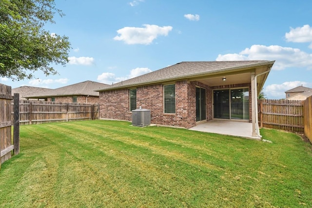 513 Heinatz Flat Ln, Leander, TX 78641 - rear view of house featuring a patio area, brick siding, and a fenced backyard