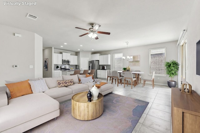 513 Heinatz Flat Ln, Leander, TX 78641 - living area featuring ceiling fan and light tile patterned floors