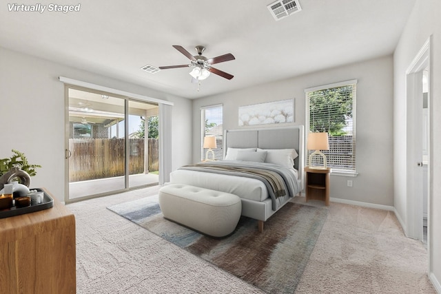 513 Heinatz Flat Ln, Leander, TX 78641 - carpeted bedroom with access to exterior, multiple windows, and a ceiling fan