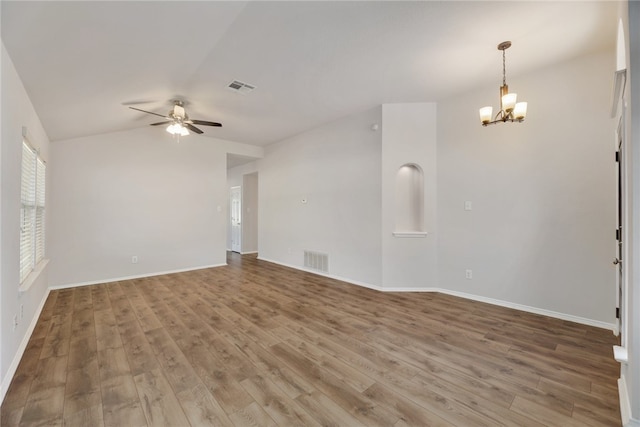 14400 Mowsbury Dr, Austin, TX 78717 - empty room with ceiling fan, a chandelier, wood finished floors, and lofted ceiling