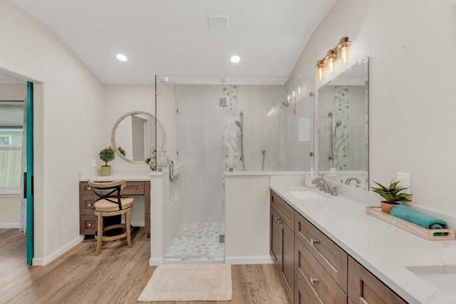 815 Clarence Bohls Ln, Pflugerville, TX 78660 - bathroom with wood finished floors, double vanity, a stall shower, and recessed lighting