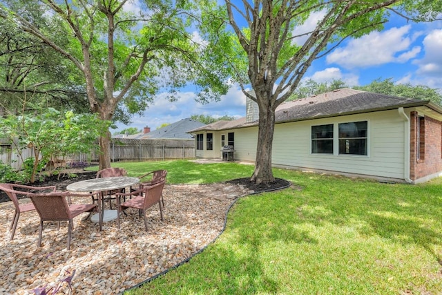 815 Clarence Bohls Ln, Pflugerville, TX 78660 - fenced backyard featuring outdoor dining space