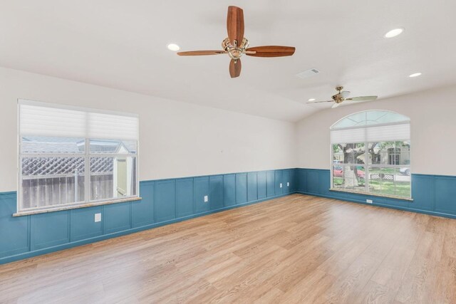 815 Clarence Bohls Ln, Pflugerville, TX 78660 - empty room featuring ceiling fan, wood finished floors, wainscoting, recessed lighting, and lofted ceiling