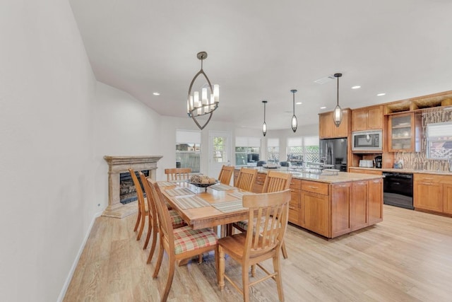 815 Clarence Bohls Ln, Pflugerville, TX 78660 - dining area with light wood finished floors, recessed lighting, and a chandelier