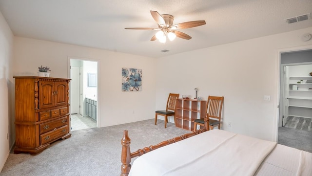 8086 Thaxton Rd, Austin, TX 78747 - bedroom with light colored carpet, connected bathroom, and a ceiling fan