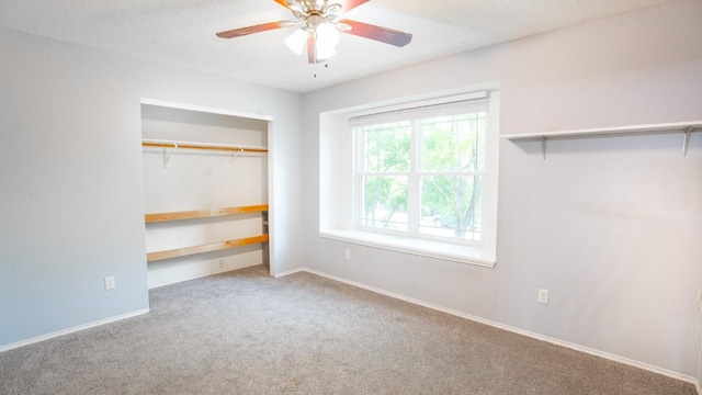 8086 Thaxton Rd, Austin, TX 78747 - unfurnished bedroom with carpet, a closet, a textured ceiling, and a ceiling fan