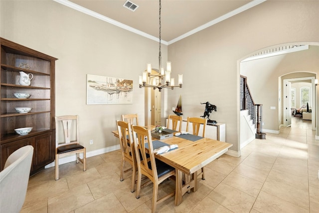 1073 Las Brisas Dr, Canyon Lake, TX 78133 - dining space with arched walkways, a towering ceiling, a chandelier, crown molding, and light tile patterned floors