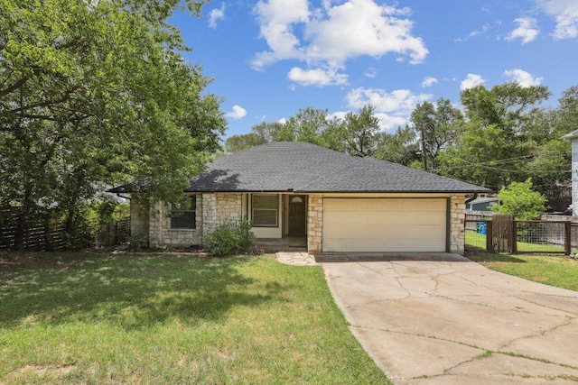 1613 J J Seabrook Dr, Austin, TX 78721 - view of front of home with stone siding, an attached garage, concrete driveway, and roof with shingles