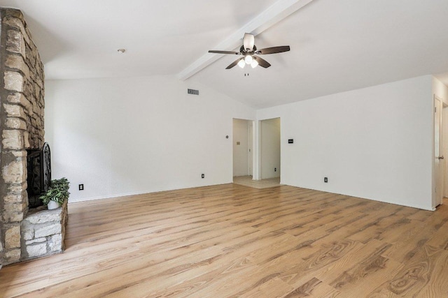 1613 J J Seabrook Dr, Austin, TX 78721 - unfurnished living room featuring ceiling fan, light wood finished floors, and a large fireplace