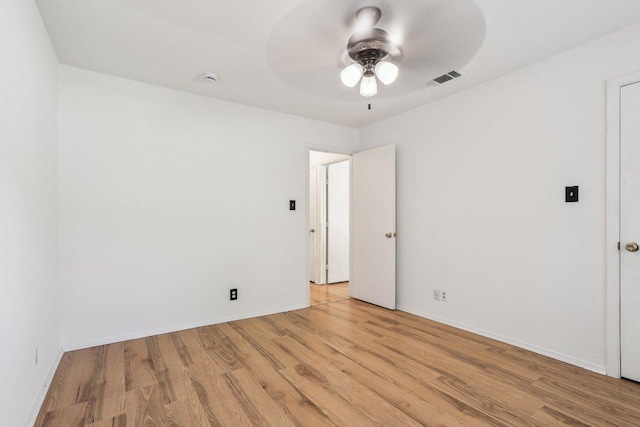 1613 J J Seabrook Dr, Austin, TX 78721 - empty room with a ceiling fan and light wood-style flooring