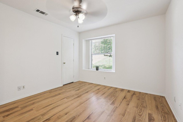 1613 J J Seabrook Dr, Austin, TX 78721 - unfurnished room featuring light wood finished floors and a ceiling fan
